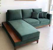 L shape sofa with bouncy cushions and lower wooden skirting