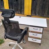Executive office desk with a headrest chair