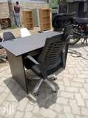 Office desk combined with a headrest chair