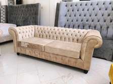Modern brown three seater chesterfield sofa
