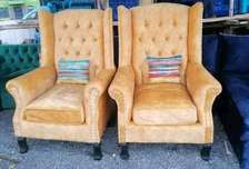 Tufted wingback arm chairs