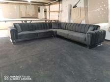 Seven seater charcoal black tufted sofa