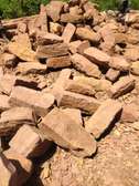 Bush stones and other buildings materials.