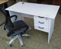 Home office writing table with an office chair