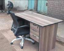 Black office chair with a wood office desk