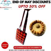 black and white sling bag and brown wooden bracelet