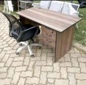 Office furniture desk combined with a swivel chair