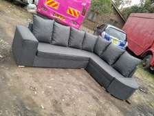 L shape of gray with pillows and good finishing