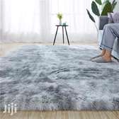 Light grey patched fluffy carpet