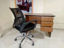 Desk chair with lumbar support and an office table