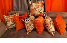 Orange printed suede pillows