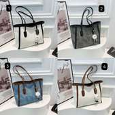 Ladies underarm classy handbag with a key doll