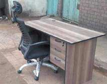 Computer desk with a headrest chair