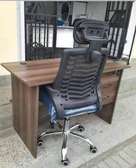 Executive office desk with a headrest chair