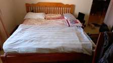 Queen size bed with mattress and pillow