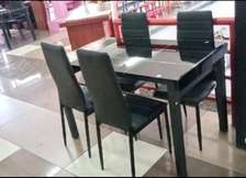 Good quality glass top dining table with chairs