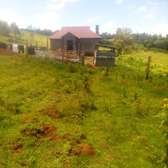 1.5 acres touching tarmac with house near Ol kalou.