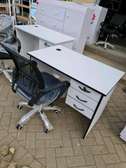 White office desk with a rotational chair