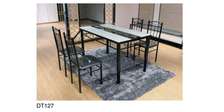 Solid glass dining room table plus chairs
