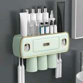 Toothbrush and Toothpaste Holder with Automatic Squeezer