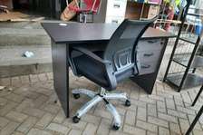 Office desk with a swivel chair