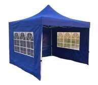 White canopy tent with sidewalls and windows