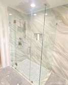 Frameless shower cubicle