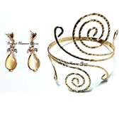 Womens Gold Tone Armlet with golden earrings