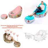 Portable inflatable seat with foot rest and manual pump