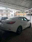 Mazda Demio sedan white
