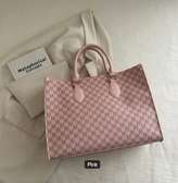 Chic Pink Designer Handbag with Repeating M Pattern