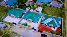 3 Modern Homes with Green Metal Roofs in Gated Compound