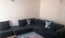 7 seater corner sofa with a matching Pouf.