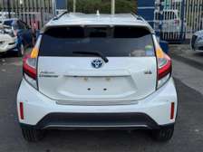 Make Toyota model Aqua white color fully loaded 2019 model.