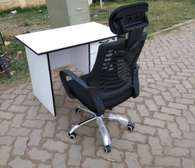 Wheeled ergonomic office chair and a work desk