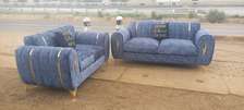 5seater sofa with spring cushions and gold ribbons and stand