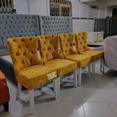 Trendy yellow tufted upholstered dining chairs