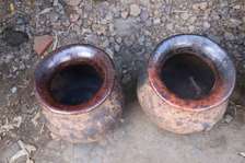 Traditional clay , cooking pots for a rich African aroma.