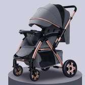 Foldable baby stroller with reversible hanldes