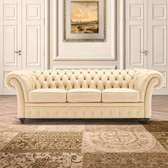 Modern three seater cream chesterfield sofa