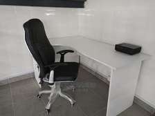 Height adjustable ergonomic chair and an L desk