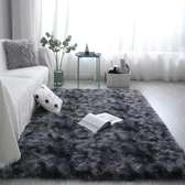 Dark grey patched fluffy carpet