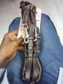 Brown leather and fabric horse riding draw reins