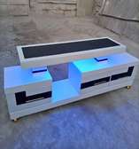 Blue lighted tv stand with drawers