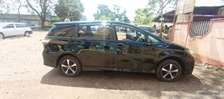 Spacious Black Minivan with Alloy Wheels