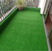 perfectly installed artificial grass for a balcony