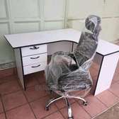 Headrest office chair with an L shaped desk