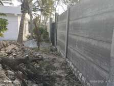 Precast fence construction