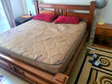 King sized bed with 2 wooden side tables (with mattress)