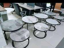 Elegant nesting coffee table with marble top.